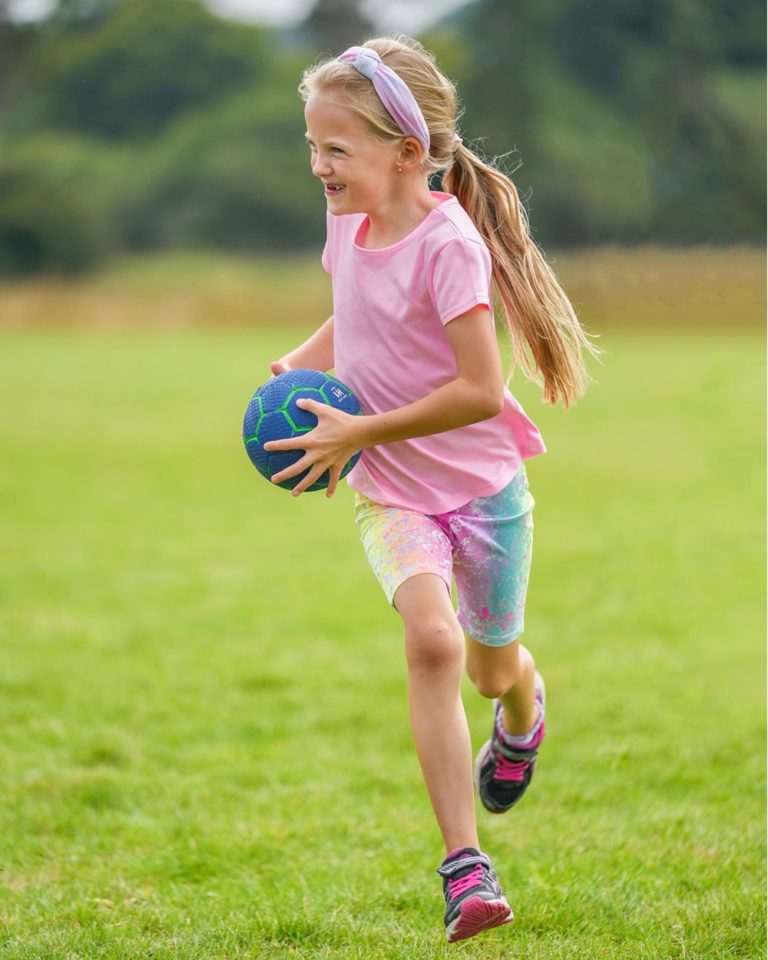A girl playing with a ball